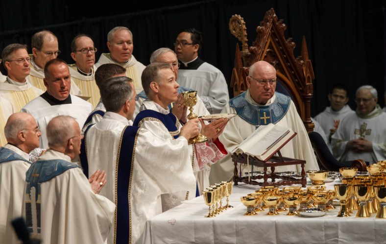 Through him and with him and in him