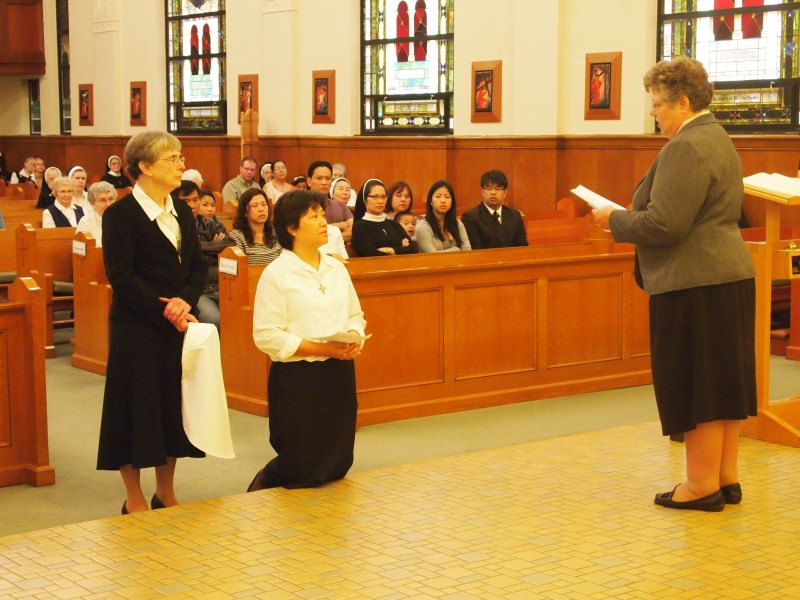 Sister Anna Nguyen receives her white veil, the symbol of a novice in religious life.