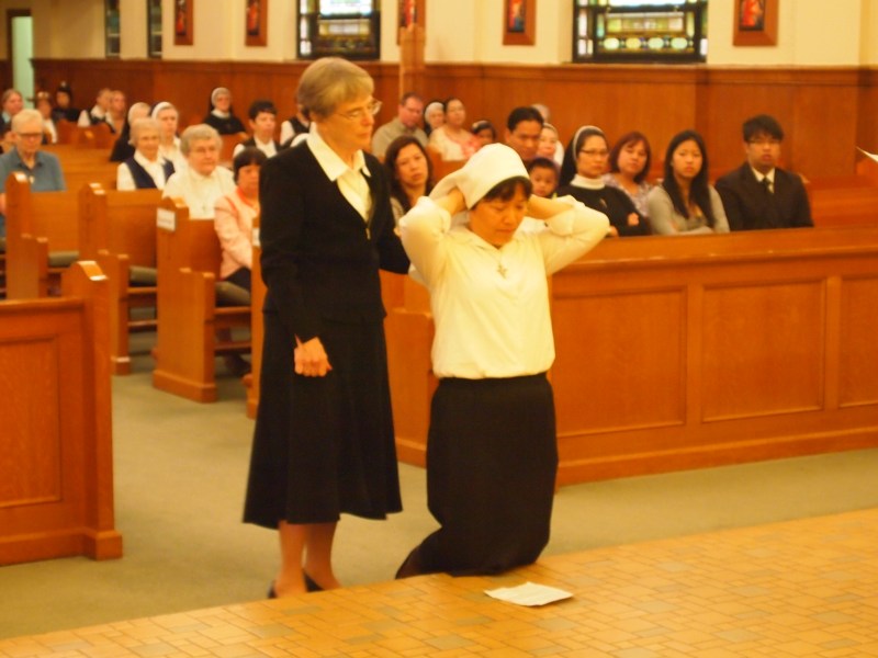 Sister Anna Nguyen adjusts her veil.