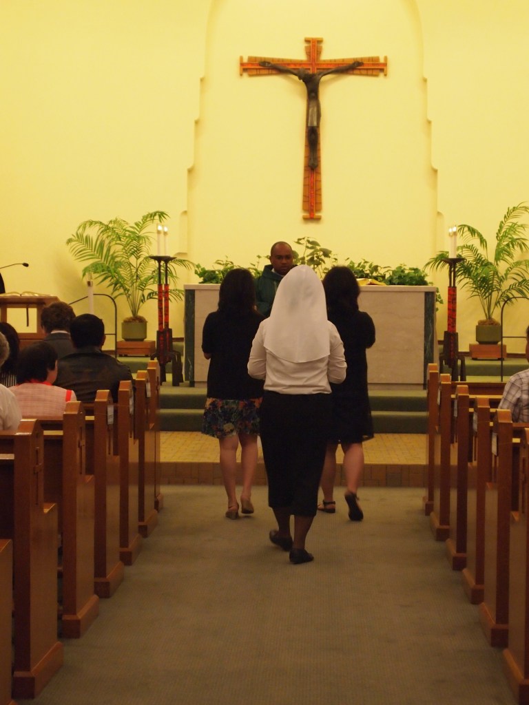 Taking the gifts of bread and wine to the altar