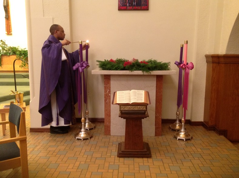 Fr. Peter lights the ADVENT candle at the Convent Chapel of the Sisters of St. Mary of Oregon.