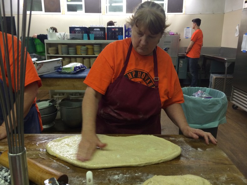 Head Cook, Fran, and crew produce some of their signature "Cheesey Rolls"