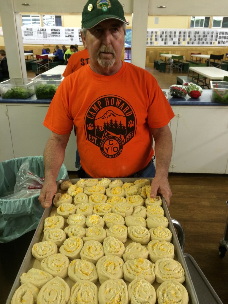 Ron gets the rolls ready to put in the oven