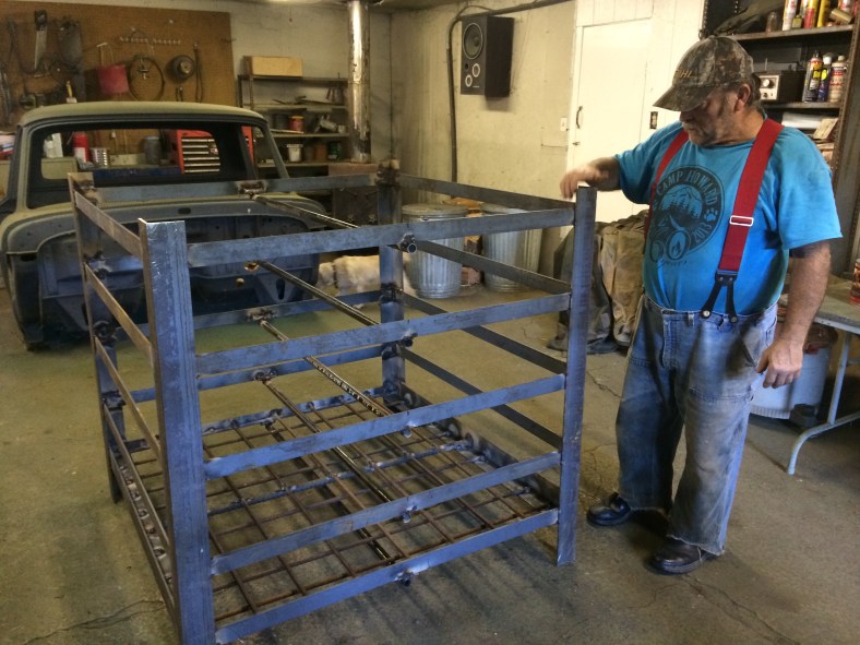 Larry Wood in his shop where he has built a prototype rock crib for Camp Howard.
