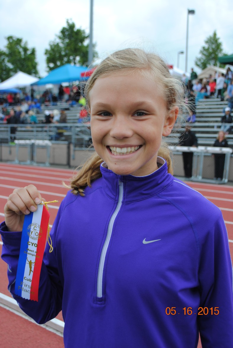 Chloe Foerster from St. Pius X CYO wins the 800 Meter Run for Cub Girls at the CYO Meet of Champions 2015