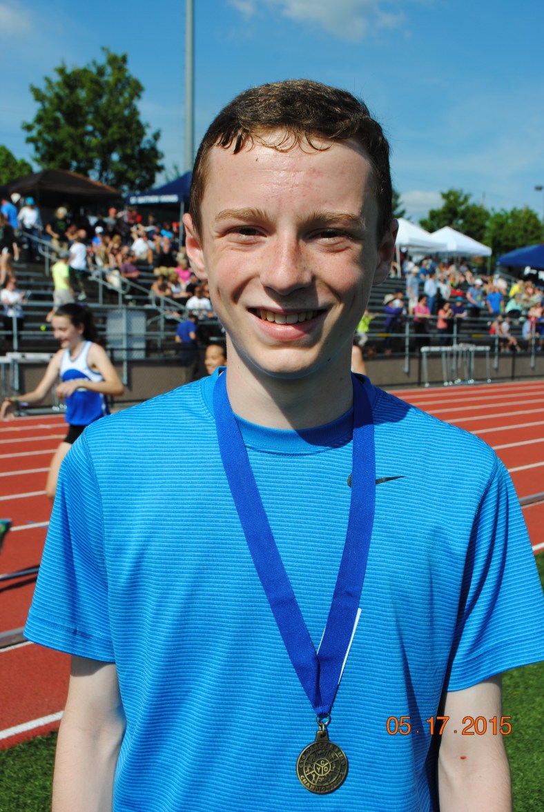 Ethan Reese from St. Pius X CYO Club takes first place in the 1500 Meter run at the CYO Meet of Champions Sunday May 17, 2015 at Jesuit High School.