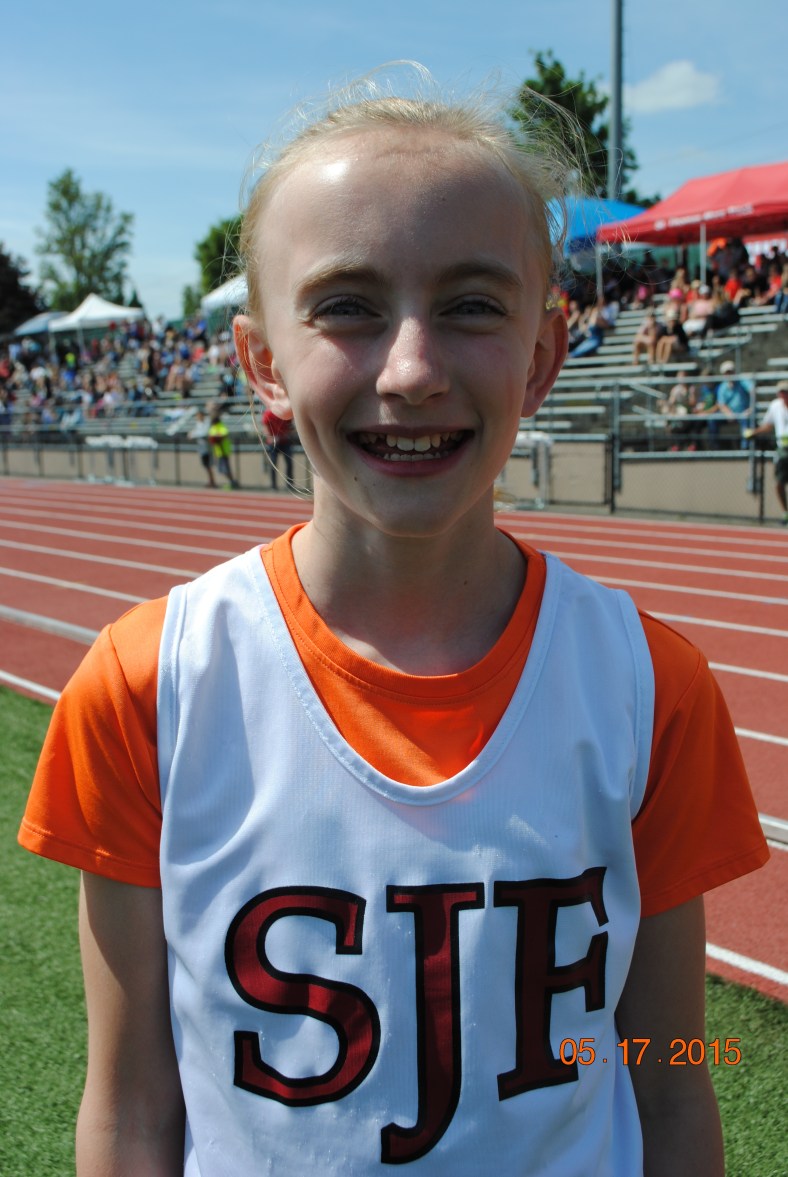 Molly Grant from St. John Fisher School wins the 400 Meter Relay at the CYO Meet of Champions May 17, 2015