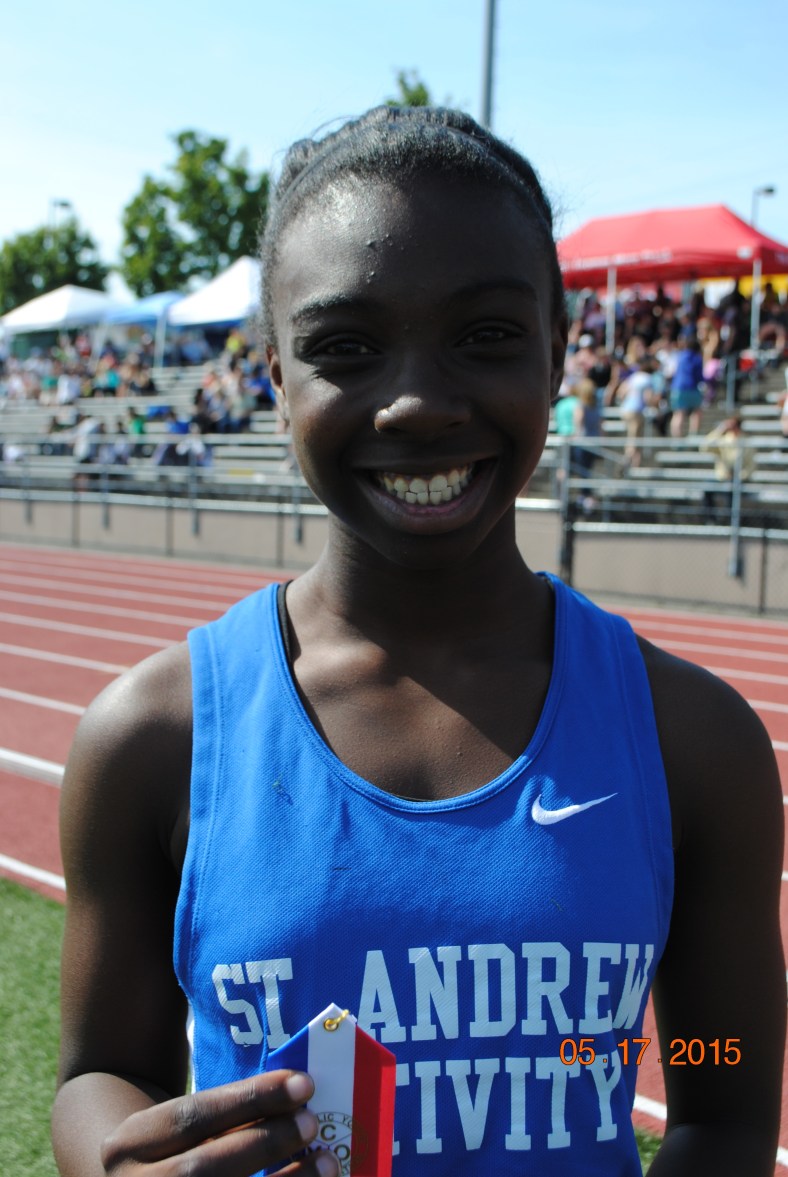 Keziah Hollands wins the 200 meter dash for Cub Girls in the 2015 CYO Meet of Champions