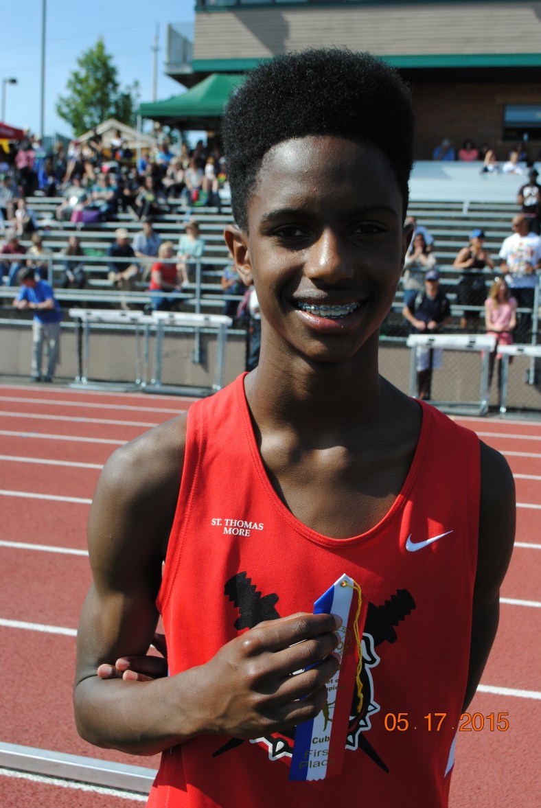Michael Brittingham wins the Cub Boys 200 Meter Dash at the 2015 CYO Meet of Champions