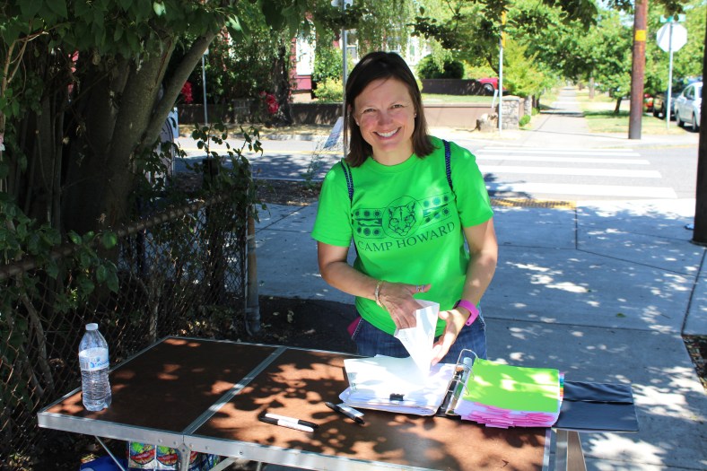 Nurse Cindy talks to parents at Bus Check in