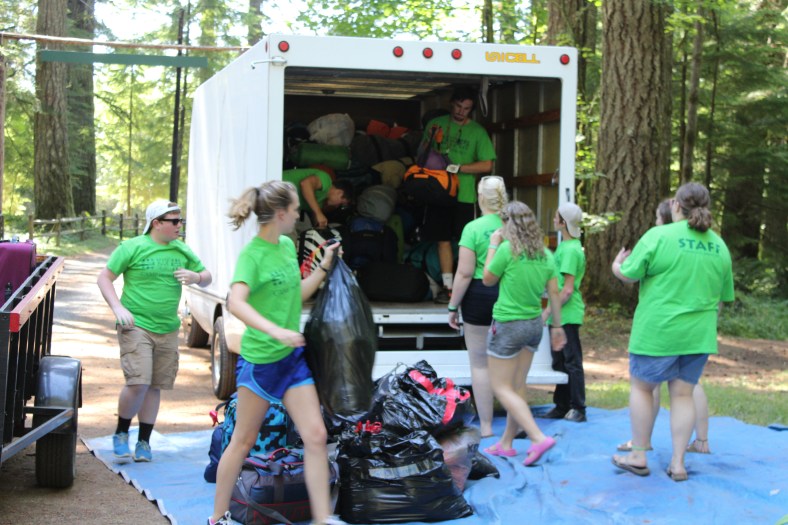 Luggage Crew unloads the luggage before the busses arrive with campers