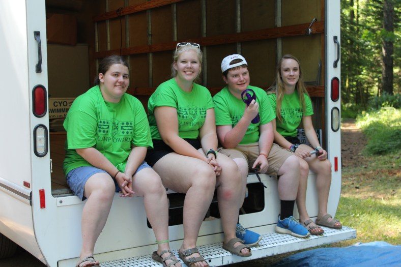 Waiting for luggage trailer to return for a new load to a different unit of cabins.