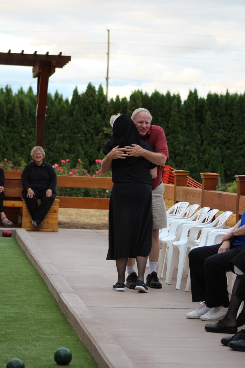 Sister Michael Francine and Lee Green congratulate one another for a great contest and tournament.